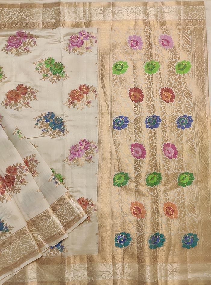 Cream muga silk handloom Banarasi saree with tilfi flower bunch boota (1) Main